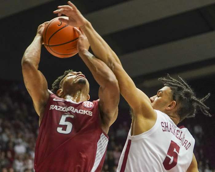 Arkansas Razorbacks guard Au'Diese Toney (5) goes to the Basket against Alabama Crimson Tide guard Jaden Shackelford (5) during the first half at Coleman Coliseum.